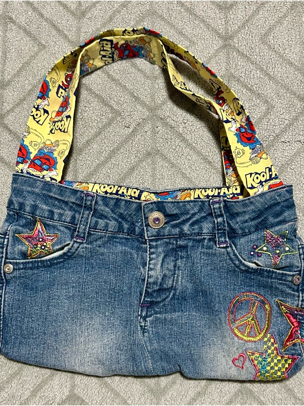 Embroidered Denim Mini Bag with Yellow Graphic Strap